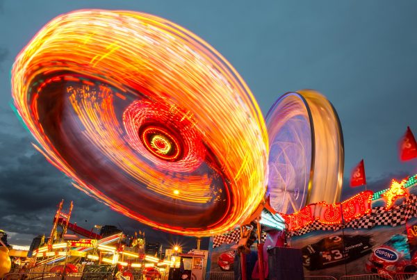 A ride at a funfair which is spinning