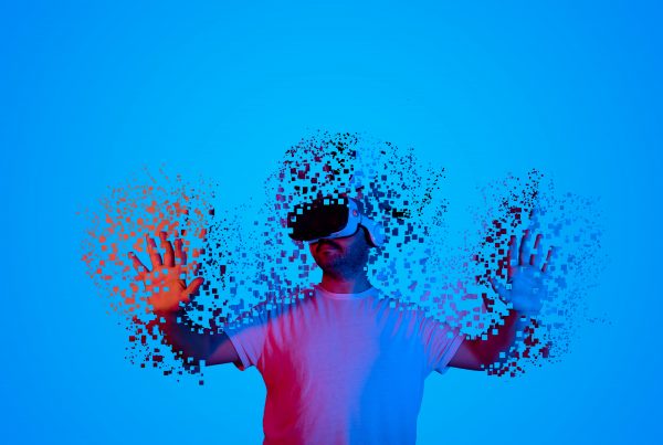 Man with a blue background wearing a VR headset