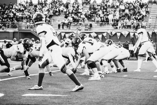 This image is showing a playoff between two teams. Using this image representation of inhouse vs outsourcing creative production model which is the topic of my blog