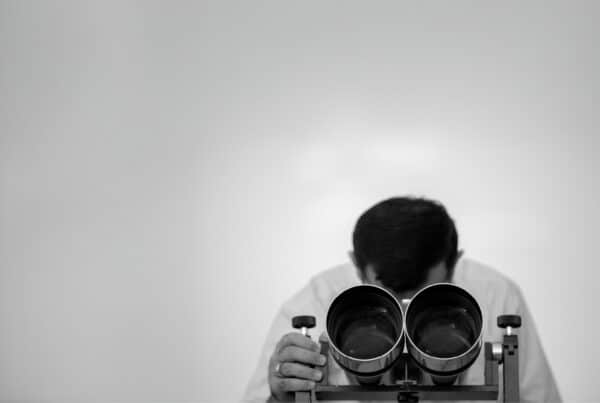 A man is looking for things that help evaluating a creative production operating model