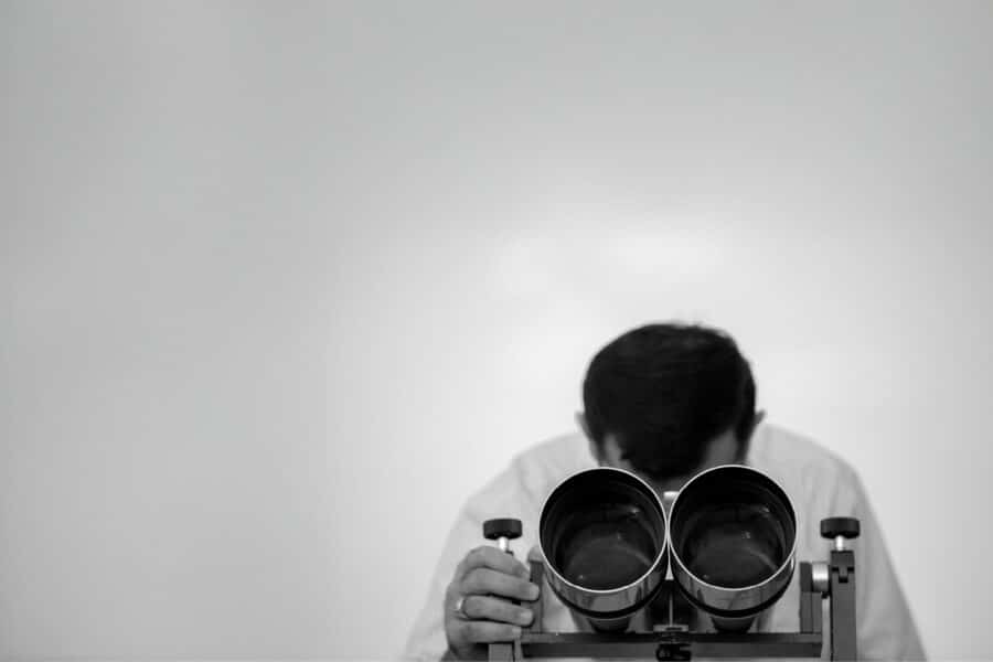 A man is looking for things that help evaluating a creative production operating model